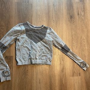 Gray long sleeve crop top with mesh and thumb holes